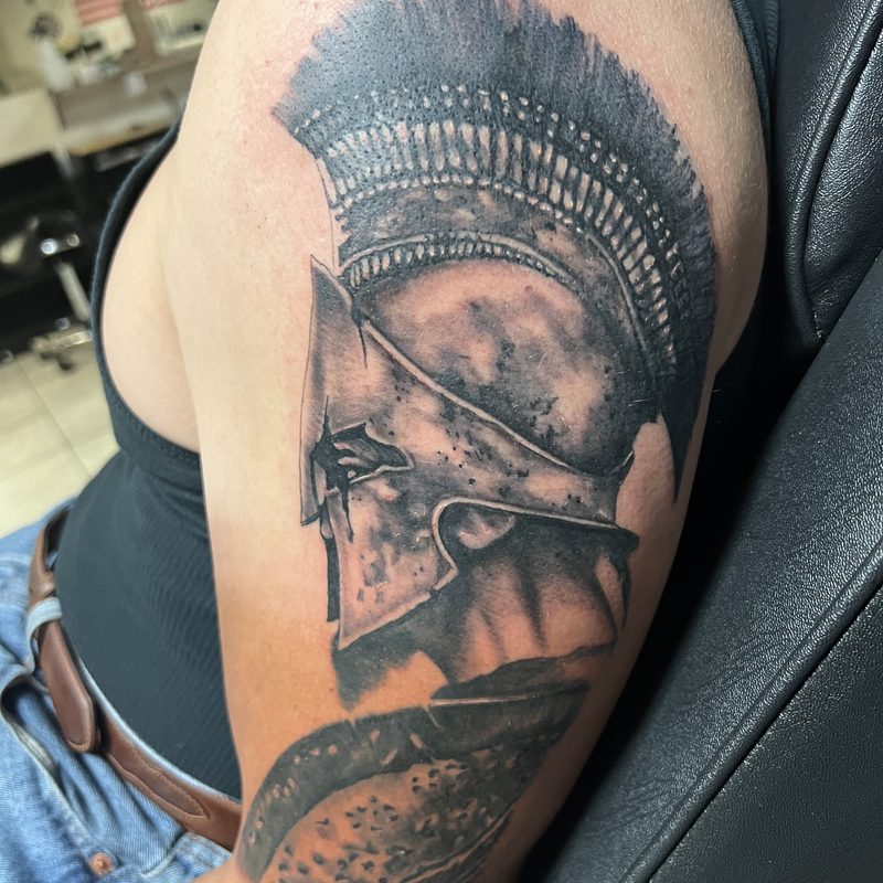Spartan helmet tattoo by Chunkytattoos