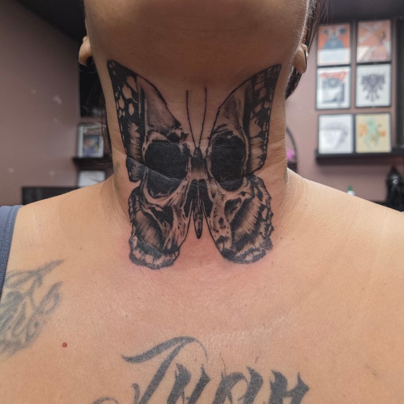 Skull butterfly tattoo by Tediyama